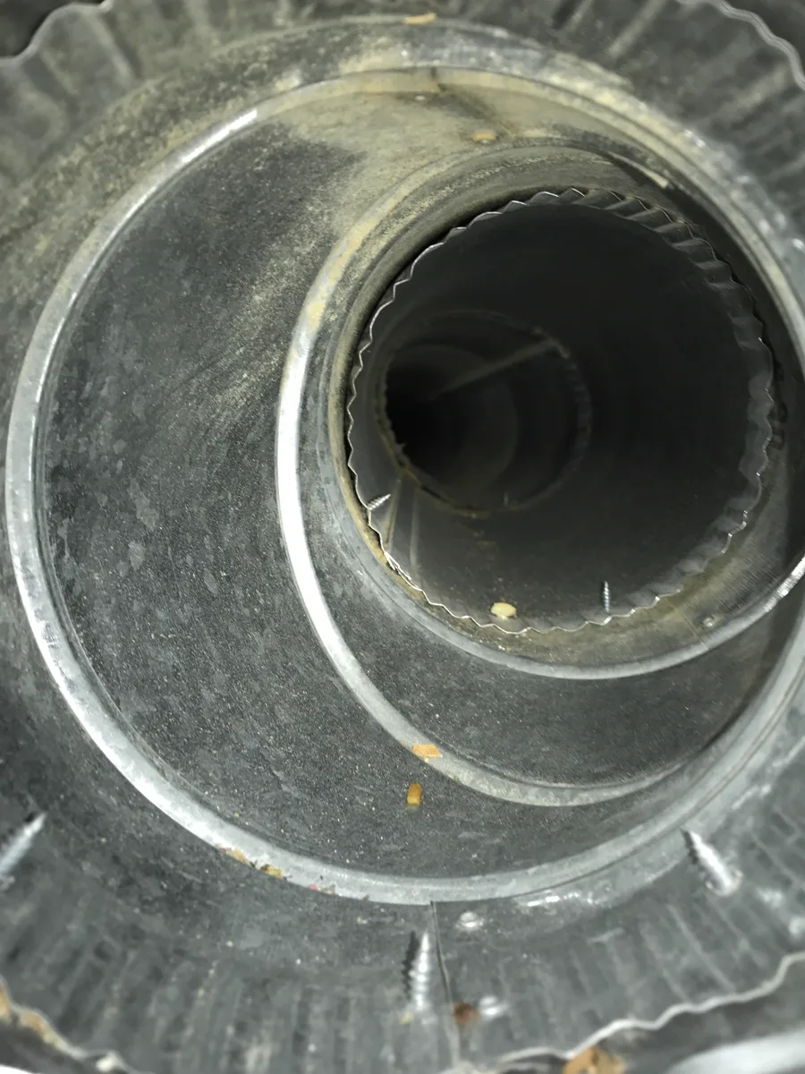 Before: Dusty round duct and collar interior